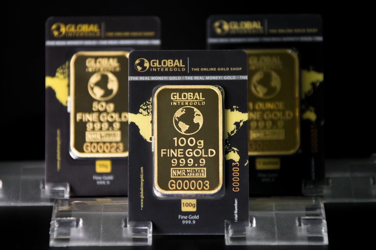 about-us Focused image of 100g Intergold bars showcasing fine gold quality and luxury.